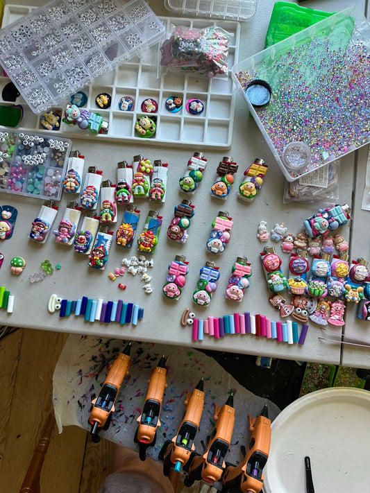 Overhead view of the colorful Drea Svea worktable covered in charms and handmade companions