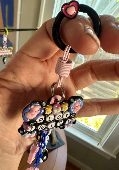 Handmade one-of-a-kind Plot Twist Pocket Pal bag charm by Drea Svea