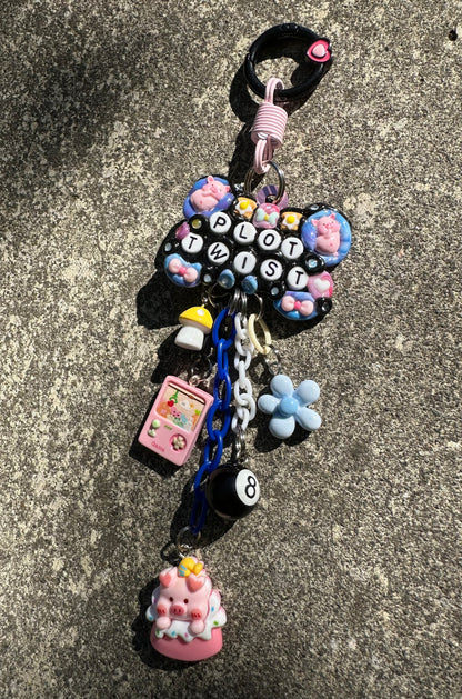 Handmade one-of-a-kind Plot Twist Pocket Pal bag charm by Drea Svea