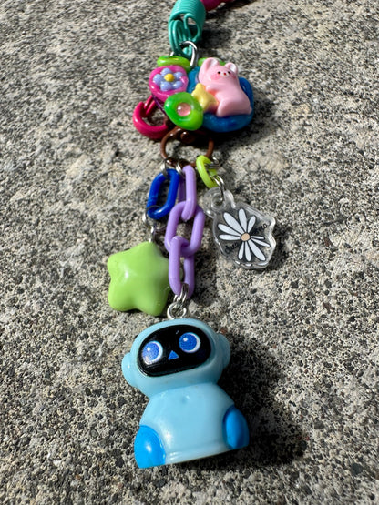 Star Child Pocket Pal blue robot charm close-up