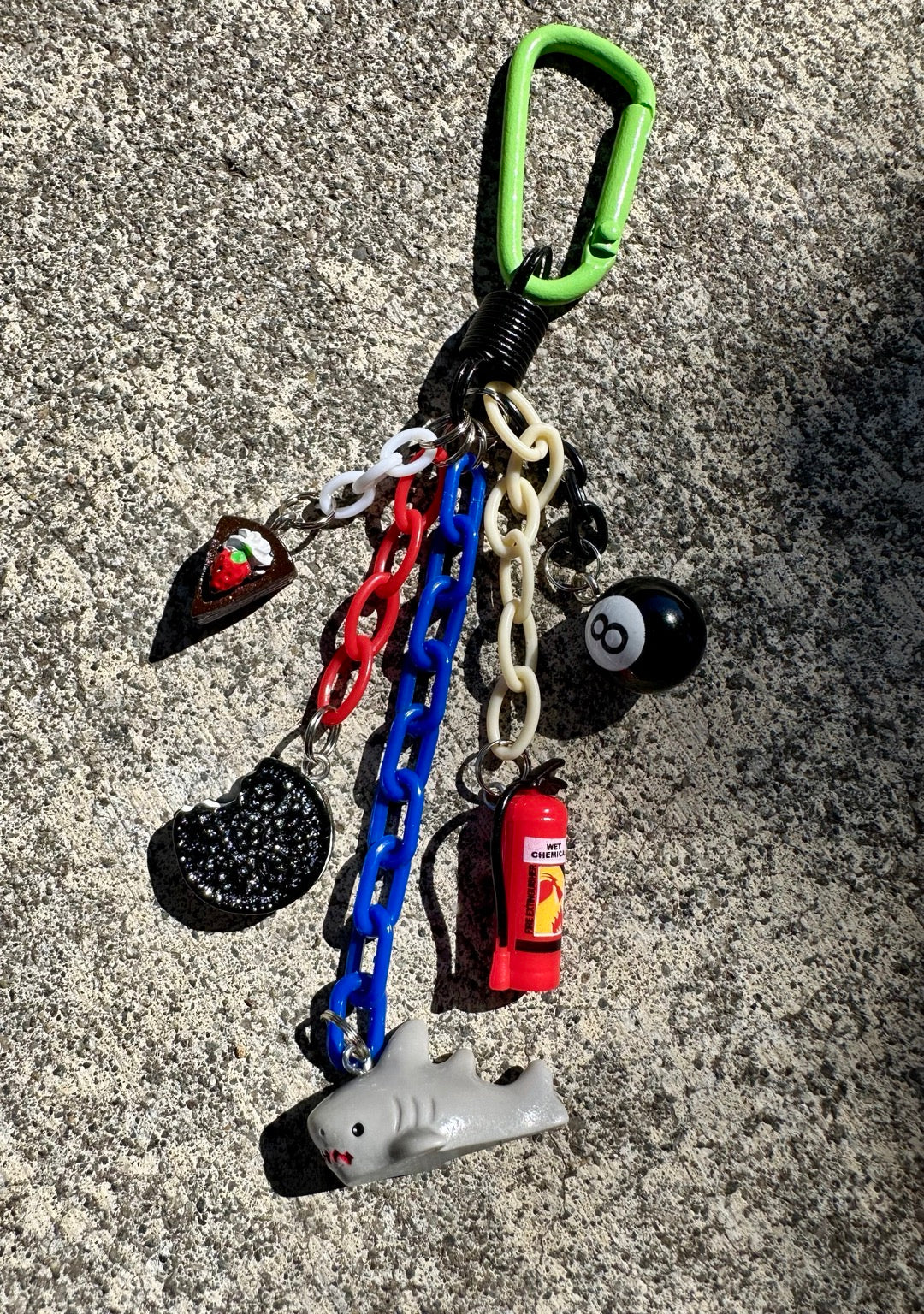 Emergency Snack Pocket Pal bag charm with shark, fire extinguisher, 8 ball, cookie and cake charms