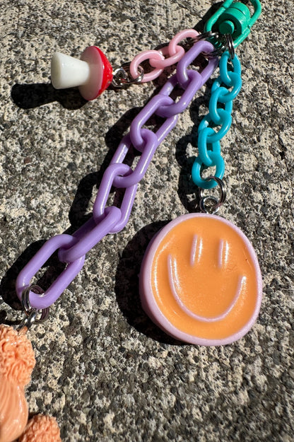 Just Happy Pocket Pal smiley face and mushroom charm detail